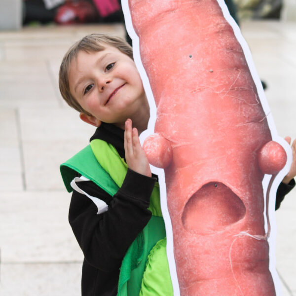 Brixton Veg Invasion - kid with carrot cut out - square supporters sign up